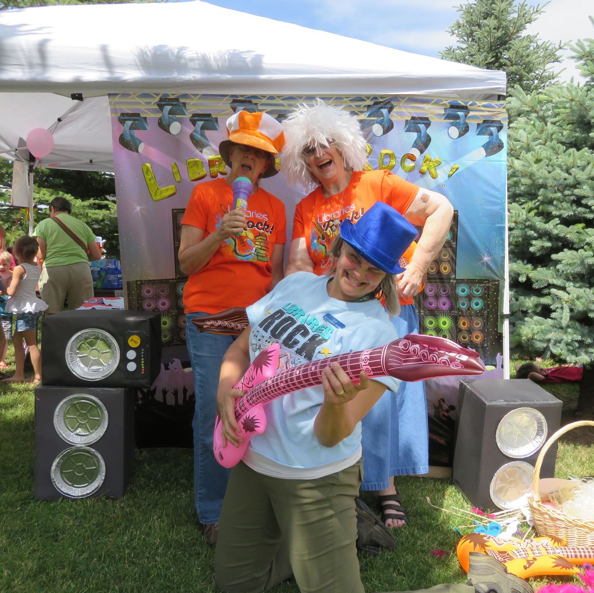 three people dressed in rock and roll costumes